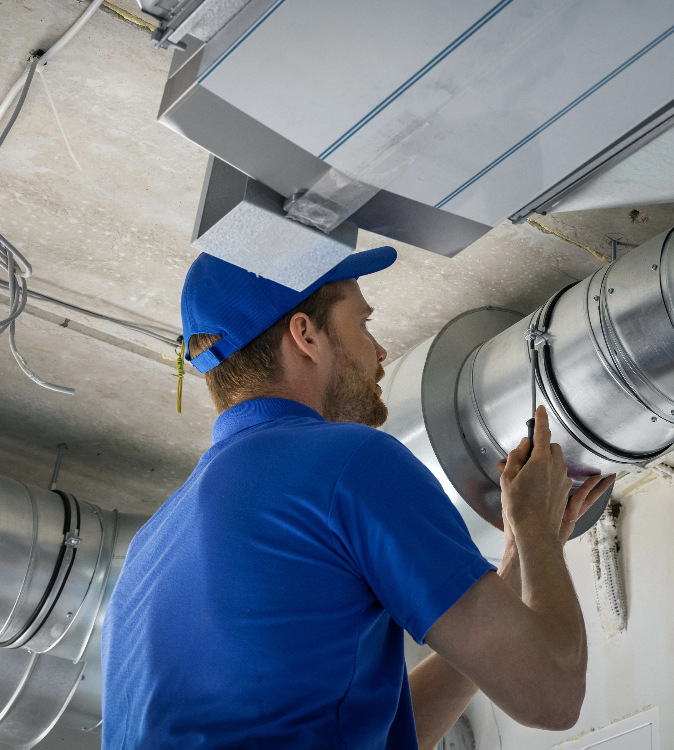 Man Working on Furnace Replacement in Calgary