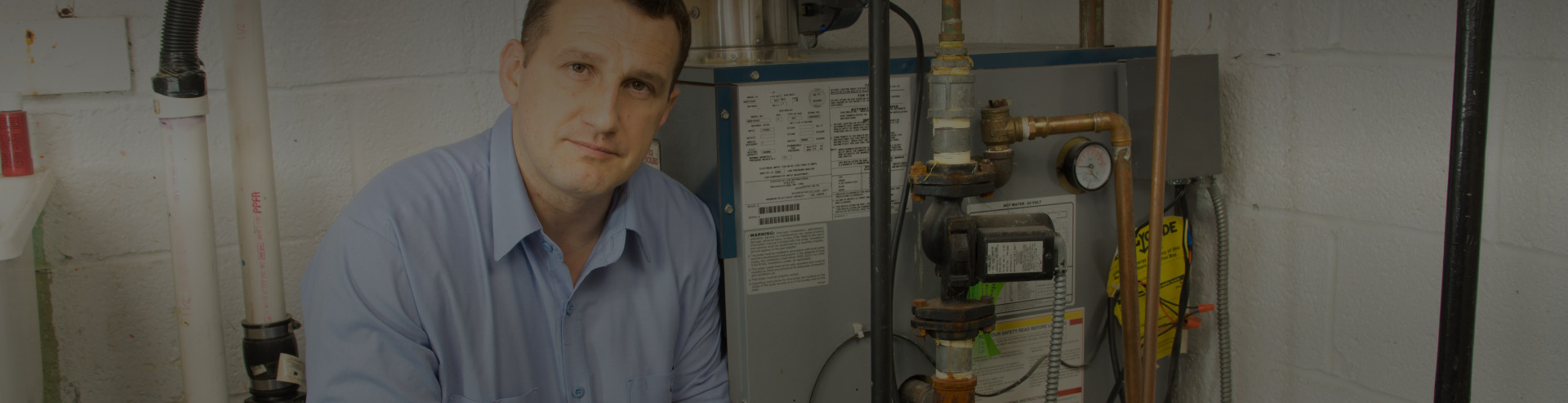 Man working on Furnace Services in Office