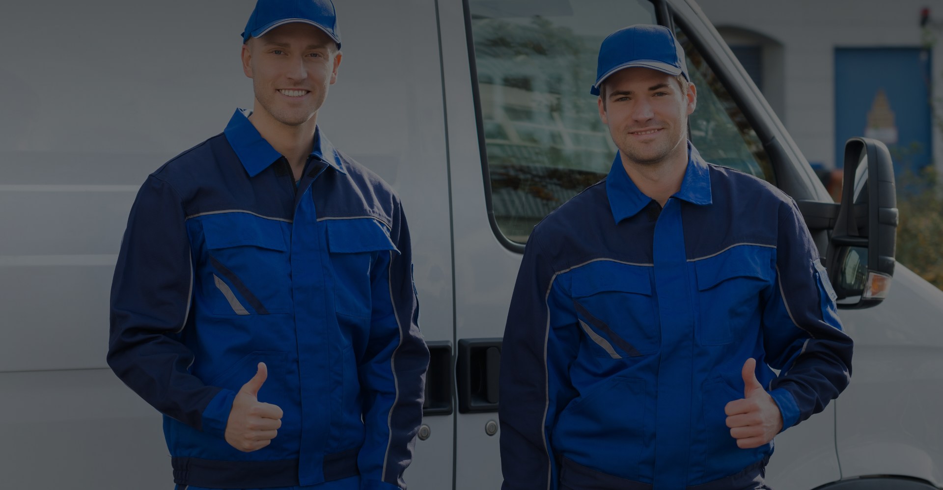 Two men in front of van