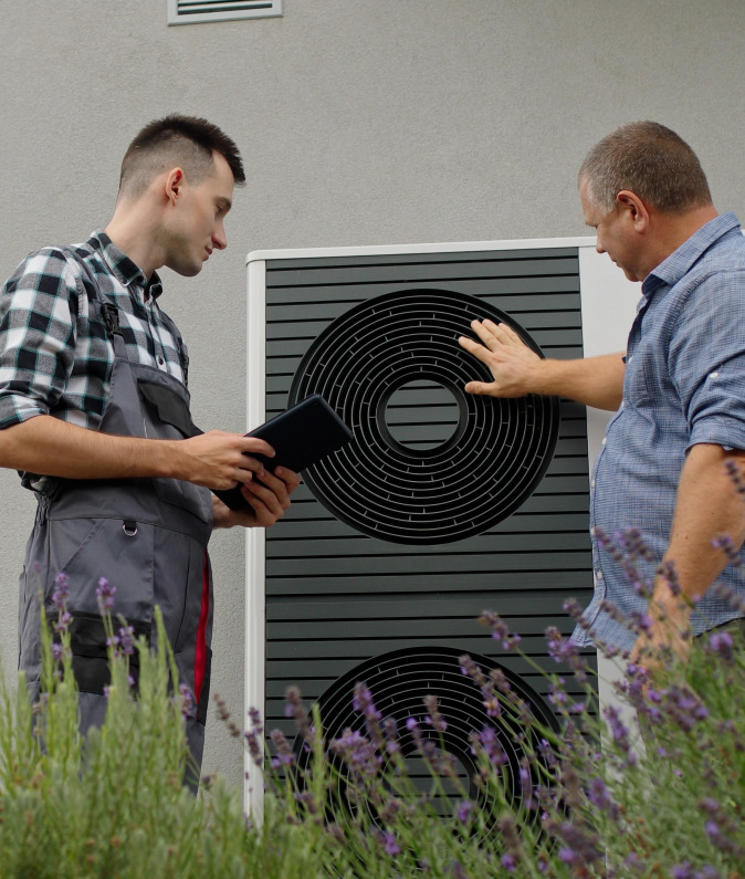 Man Checking After Heat Pump Installation in Calgary