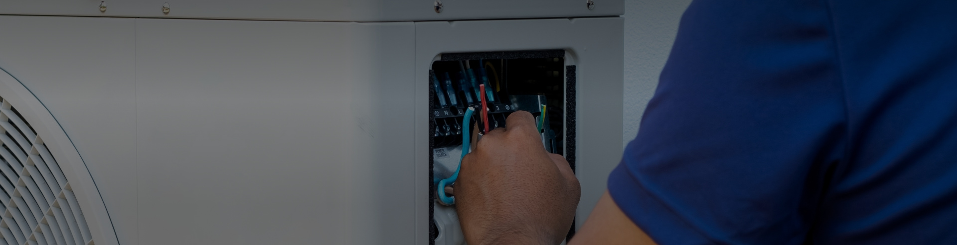 Man Doing Heat Pump Installation in Calgary