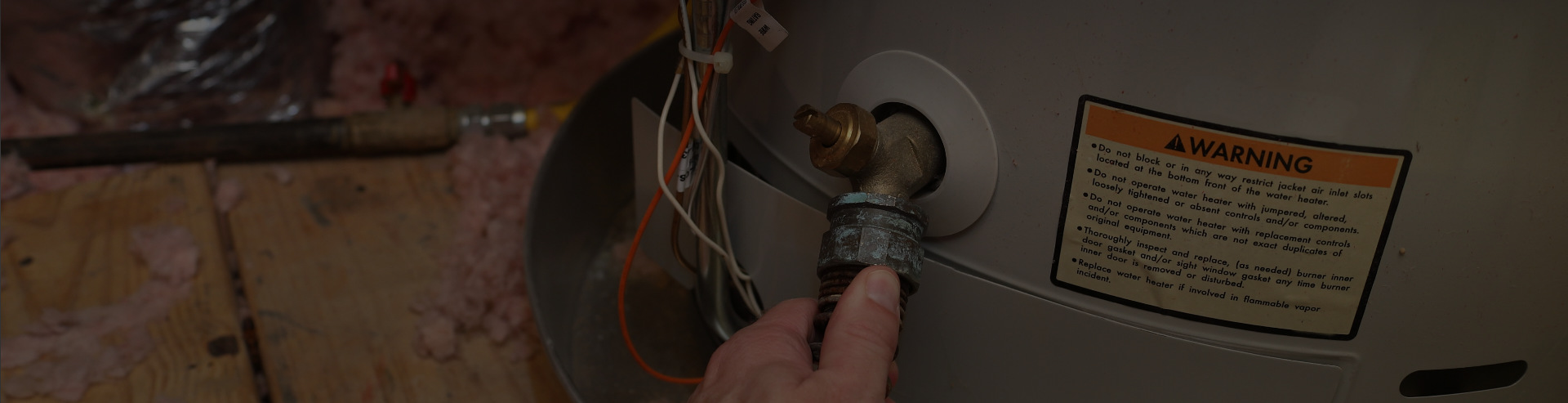 Main Doing Hot Water Tank Repair in Calgary