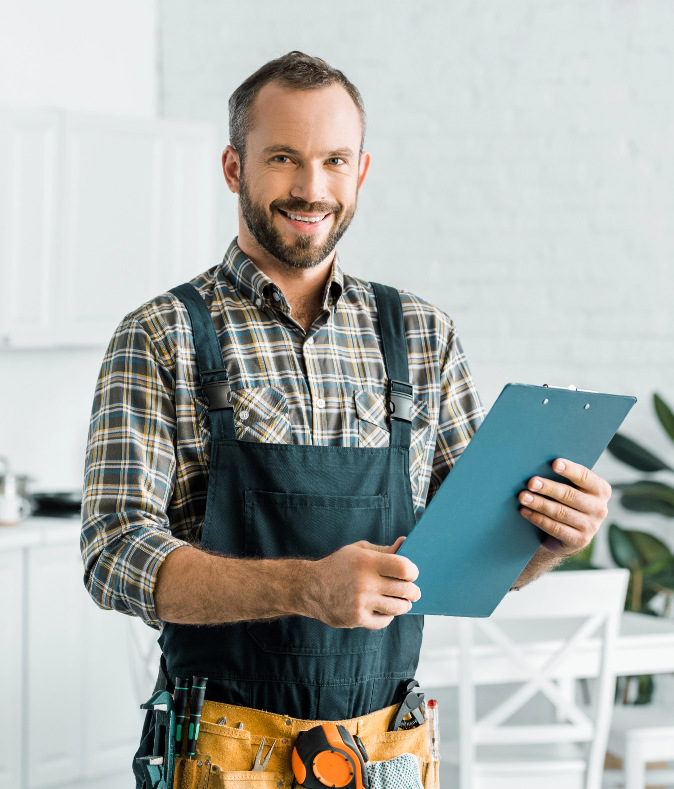 Man Doing Hot Water Tank Services in Calgary