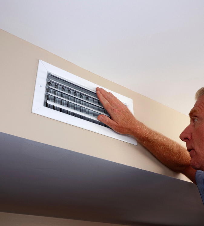 Senior Man working on Furnace Repair in Calgary